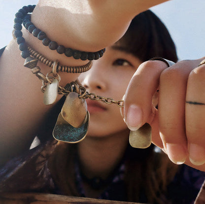 Antique brass coil and lava bead bracelet set detail shot