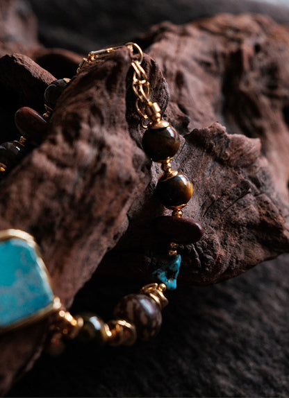 Moon Between Pines turquoise bracelet lifestyle shot on dark textured background